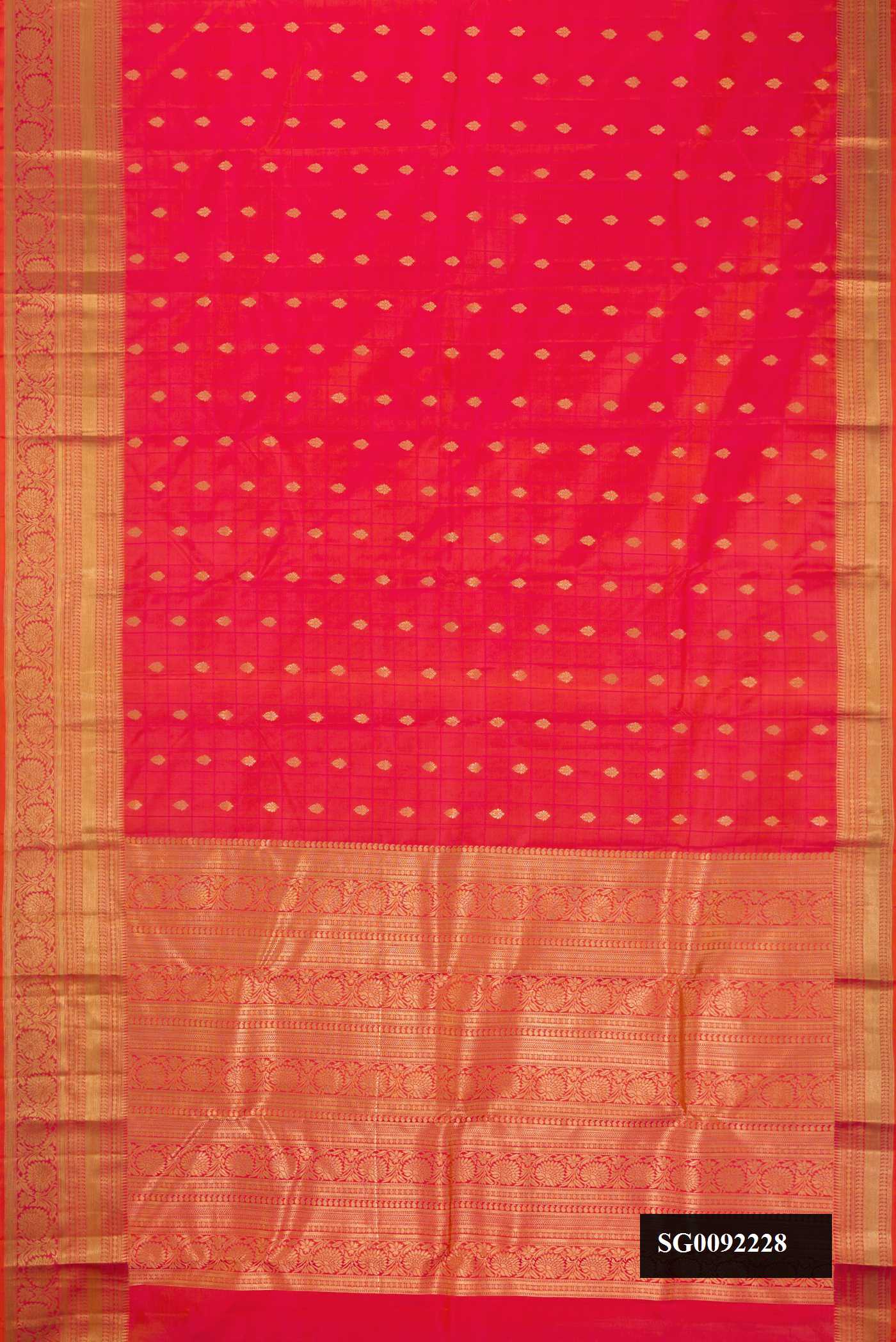 Coral Dual Tone Kanchipuram Silk Saree with Zari Butta on the body and Zari Border.  displayed on a mannequin