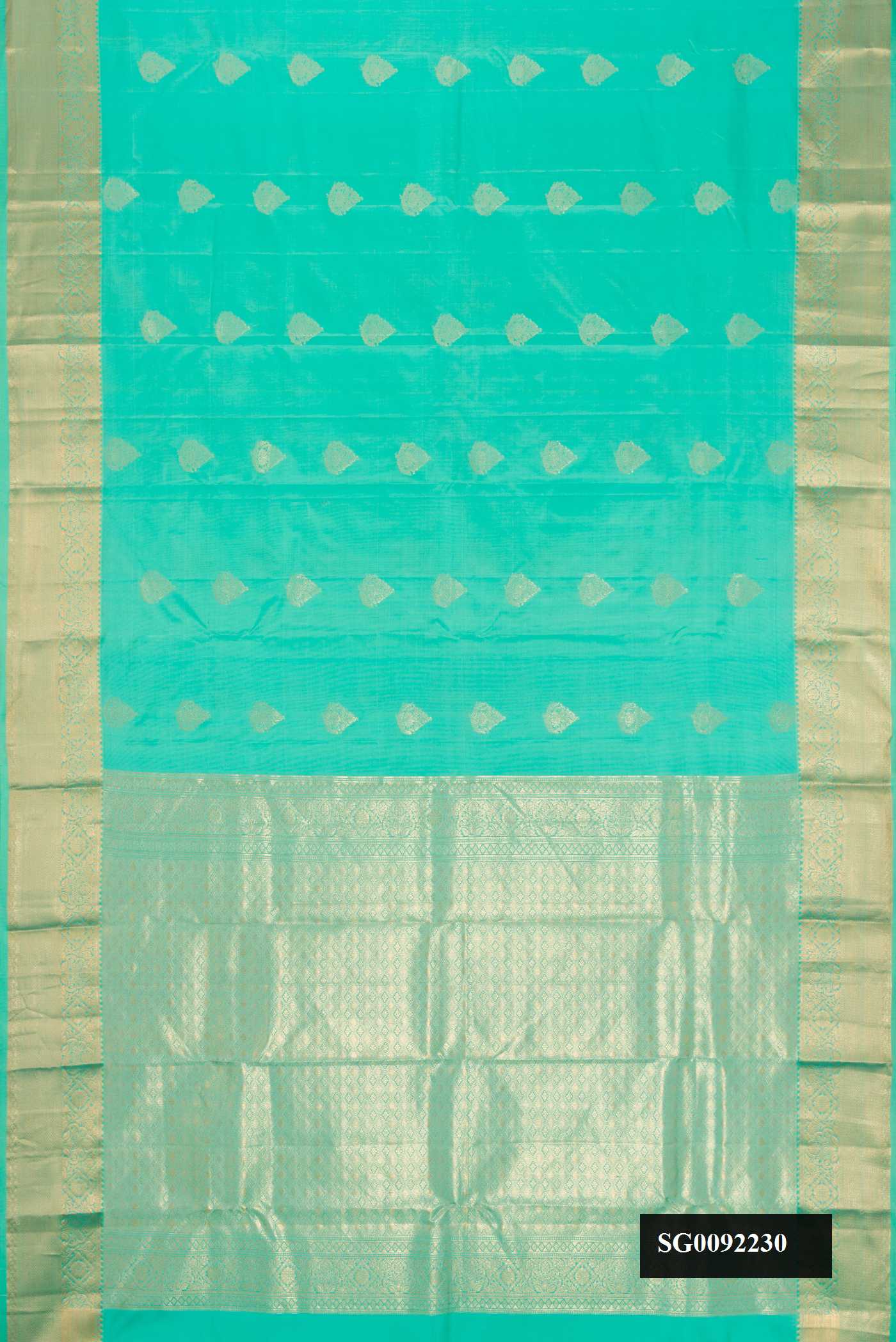 Sea Green Dual Tone Kanchipuram Silk Saree with Zari Butta on the body and Zari Border.  displayed on a mannequin
