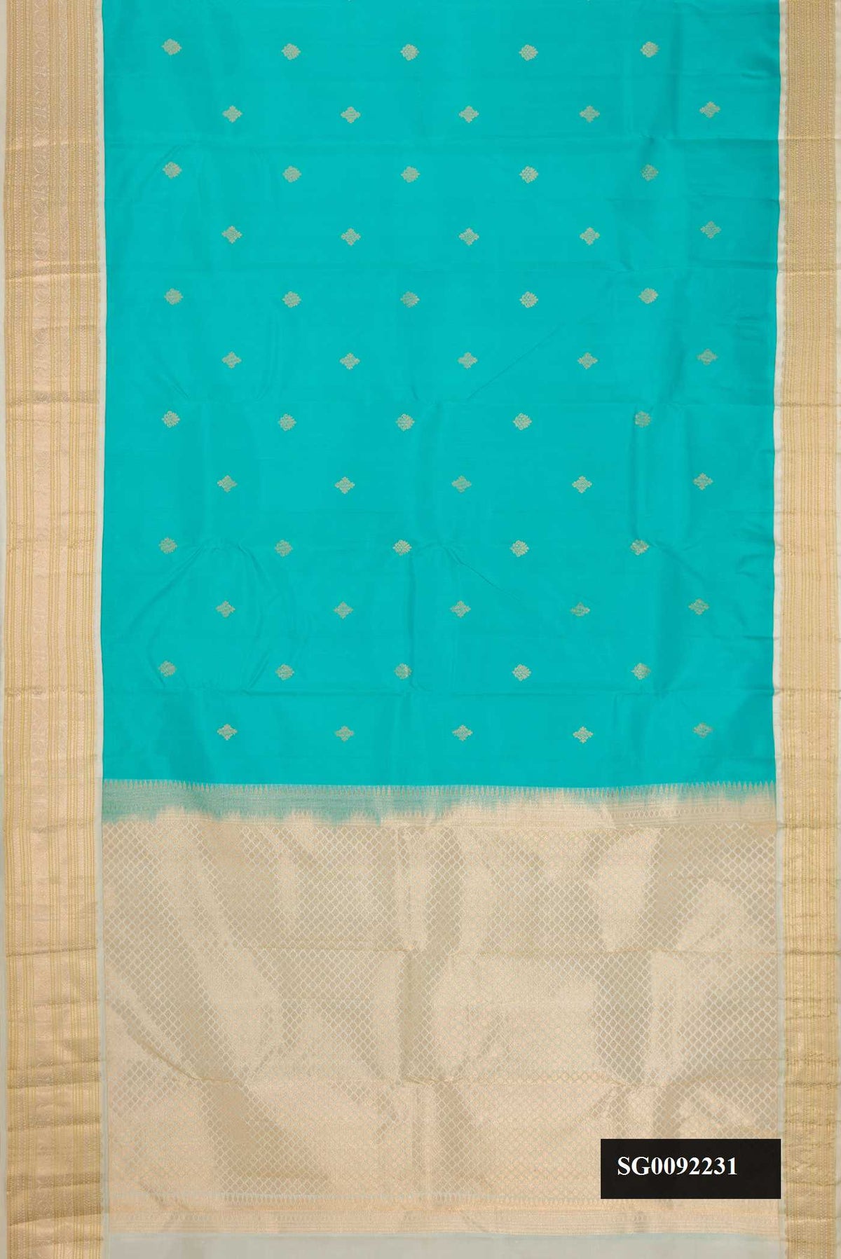 Sky Blue Dual Tone Kanchipuram Silk Saree with Zari Butta on the body and Zari Border.  displayed on a mannequin