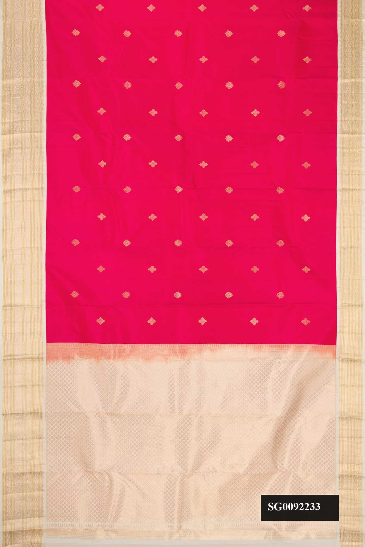 Dark Pink Dual Tone Kanchipuram Silk Saree with Zari Butta on the body and Zari Border.  displayed on a mannequin