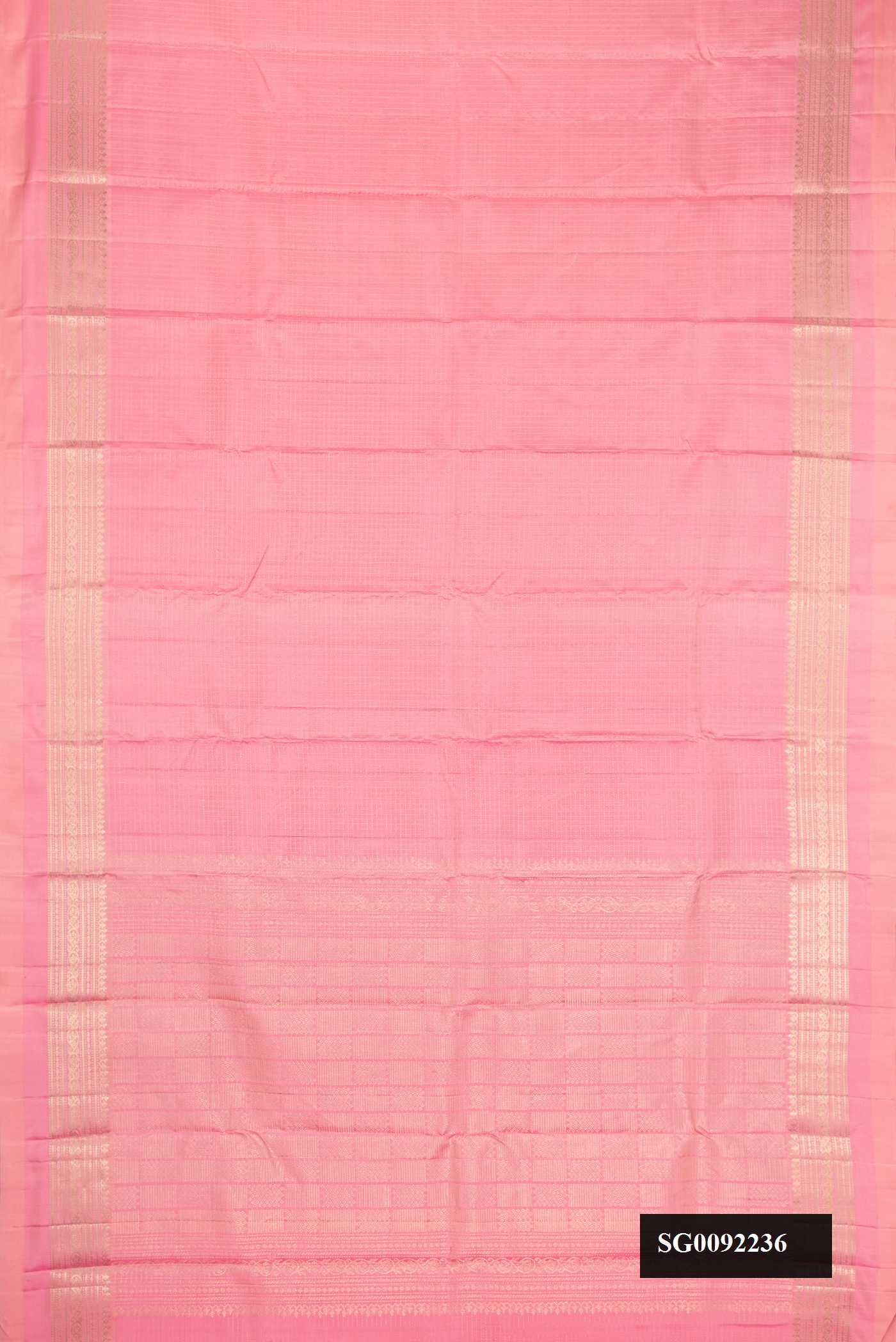 Pink Dual Tone Kanchipuram Silk Saree with Checked design on the body and Zari Border.  displayed on a mannequin