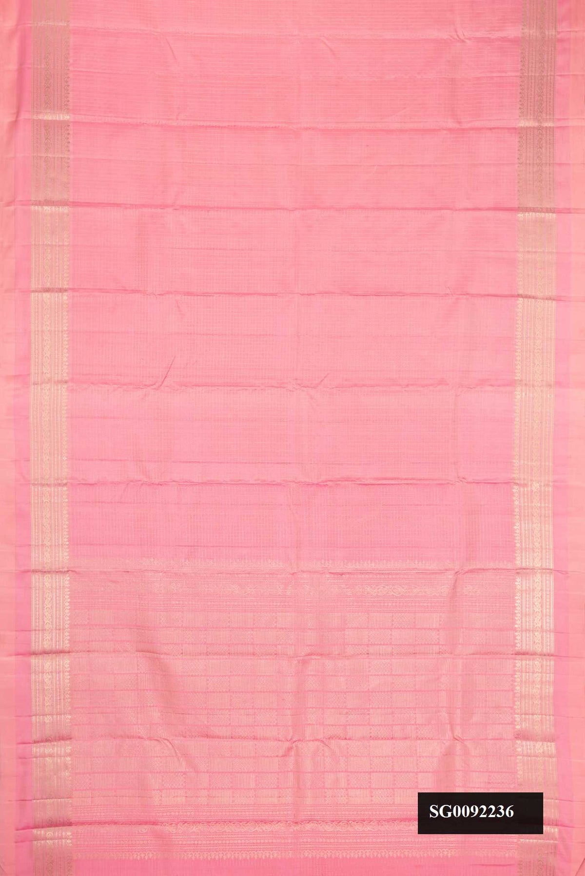Pink Dual Tone Kanchipuram Silk Saree with Checked design on the body and Zari Border.  displayed on a mannequin