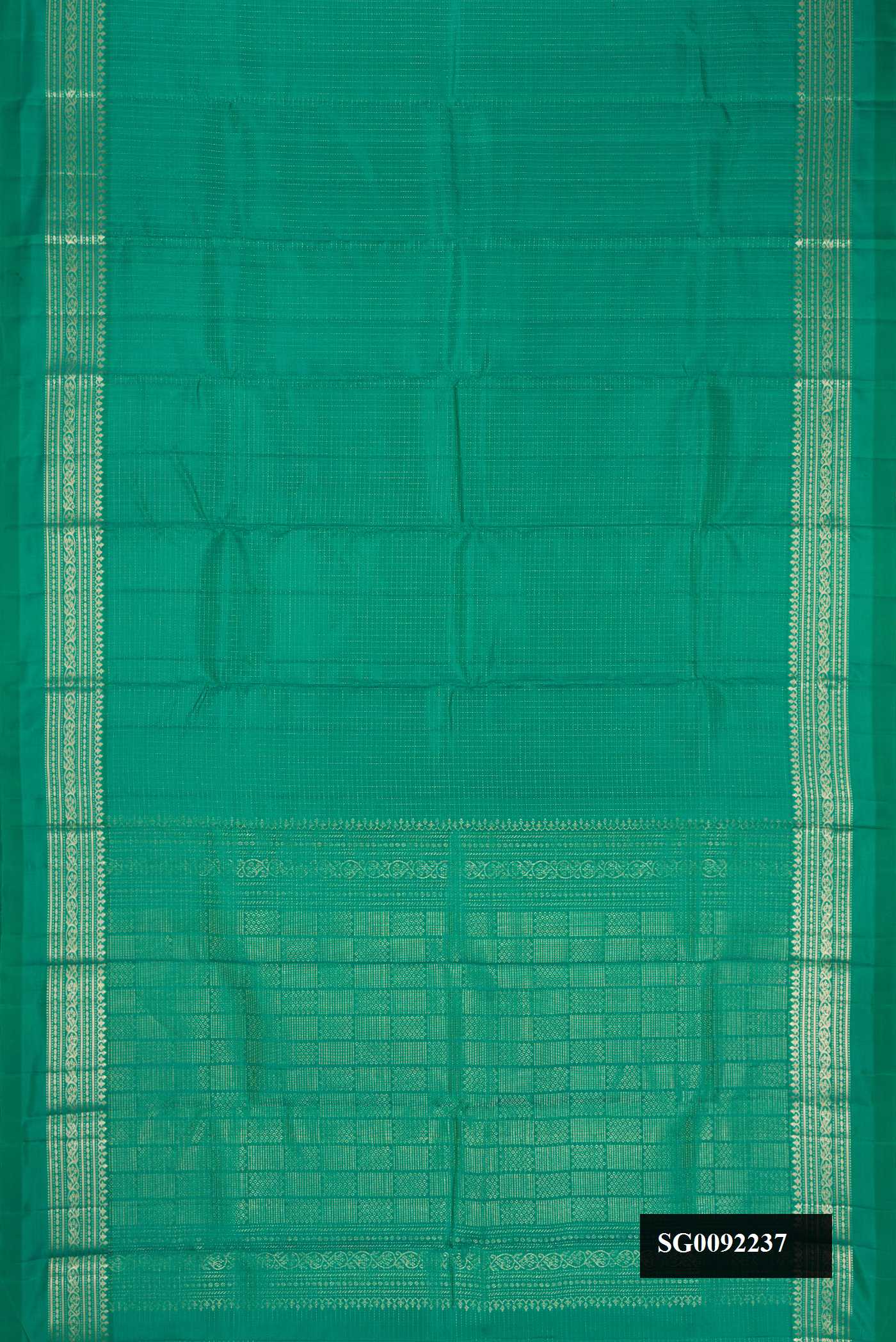 Green Dual Tone Kanchipuram Silk Saree with Checked design on the body and Zari Border.  displayed on a mannequin