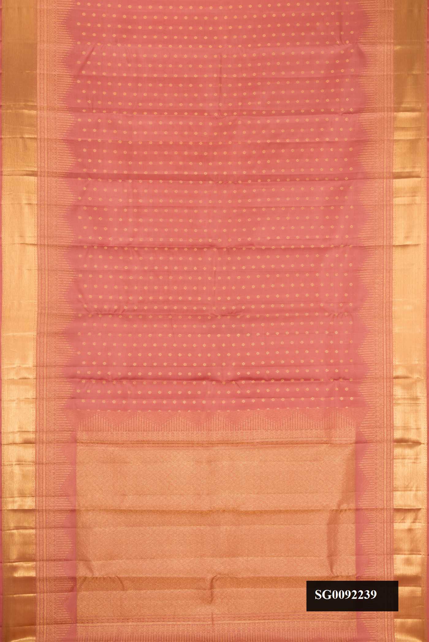 Rose Gold Dual Tone Kanchipuram Silk Saree with Zari Butta on the body and Zari Border.  displayed on a mannequin