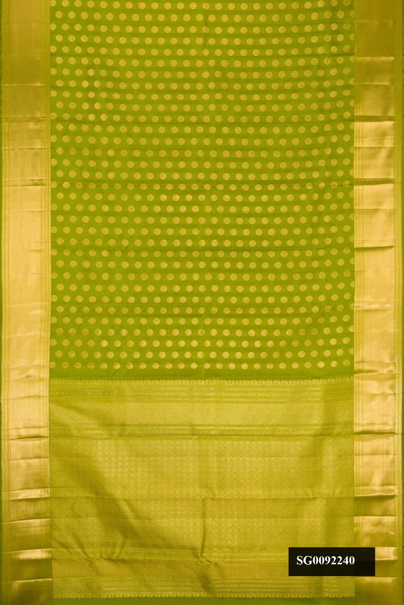 Green Dual Tone Kanchipuram Silk Saree with Zari Butta on the body and Zari Border.  displayed on a mannequin