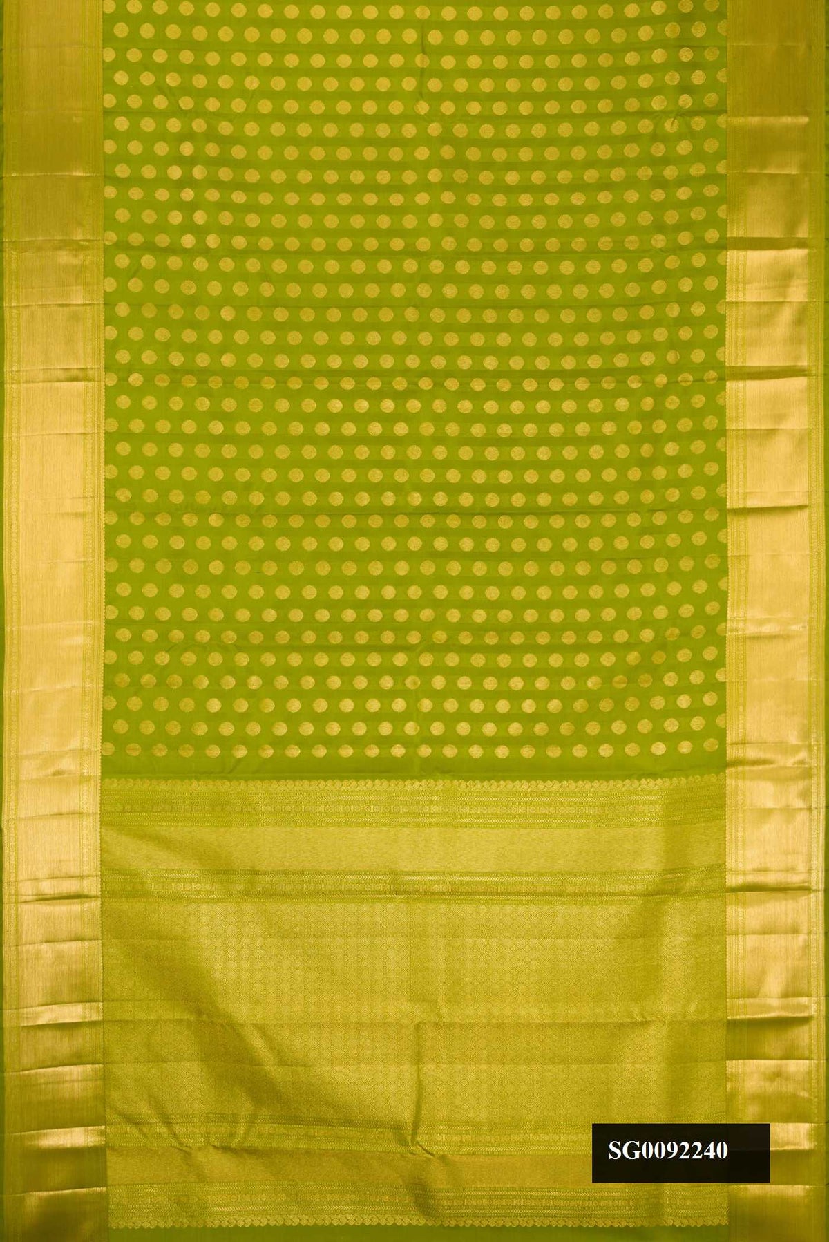 Green Dual Tone Kanchipuram Silk Saree with Zari Butta on the body and Zari Border.  displayed on a mannequin