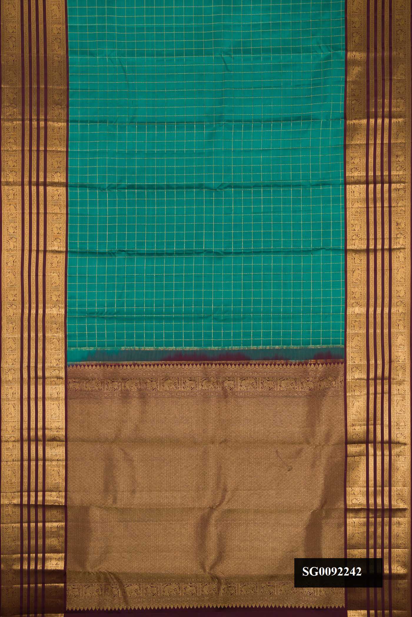 Green Dual Tone Kanchipuram Silk Saree with Checked design on the body and Zari Border.  displayed on a mannequin
