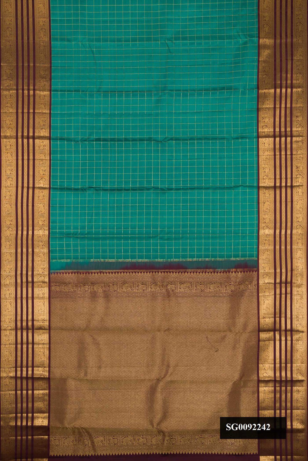 Green Dual Tone Kanchipuram Silk Saree with Checked design on the body and Zari Border.  displayed on a mannequin
