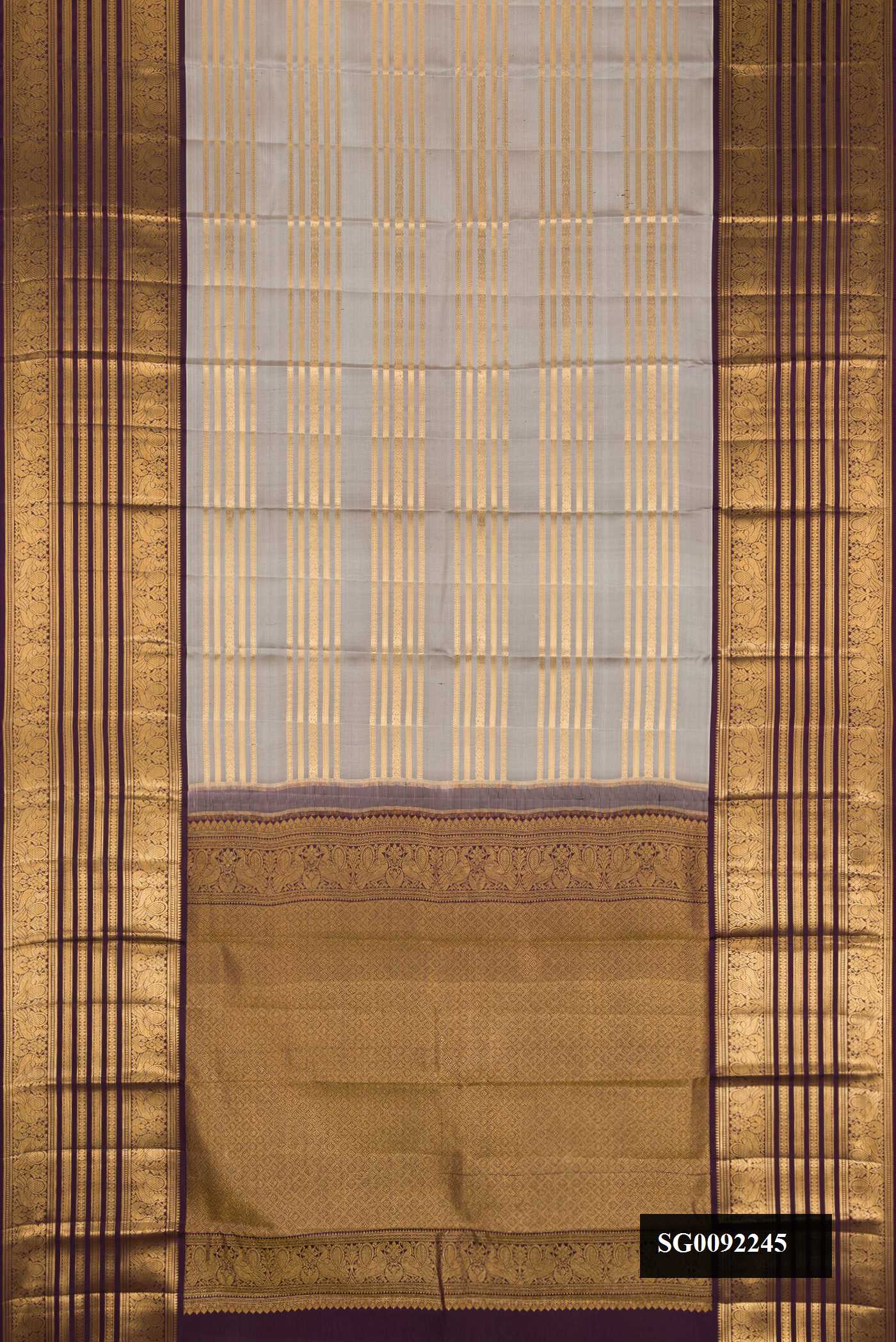 Grey Dual Tone Kanchipuram Silk Saree with Stripes on the body and Zari Border.  displayed on a mannequin