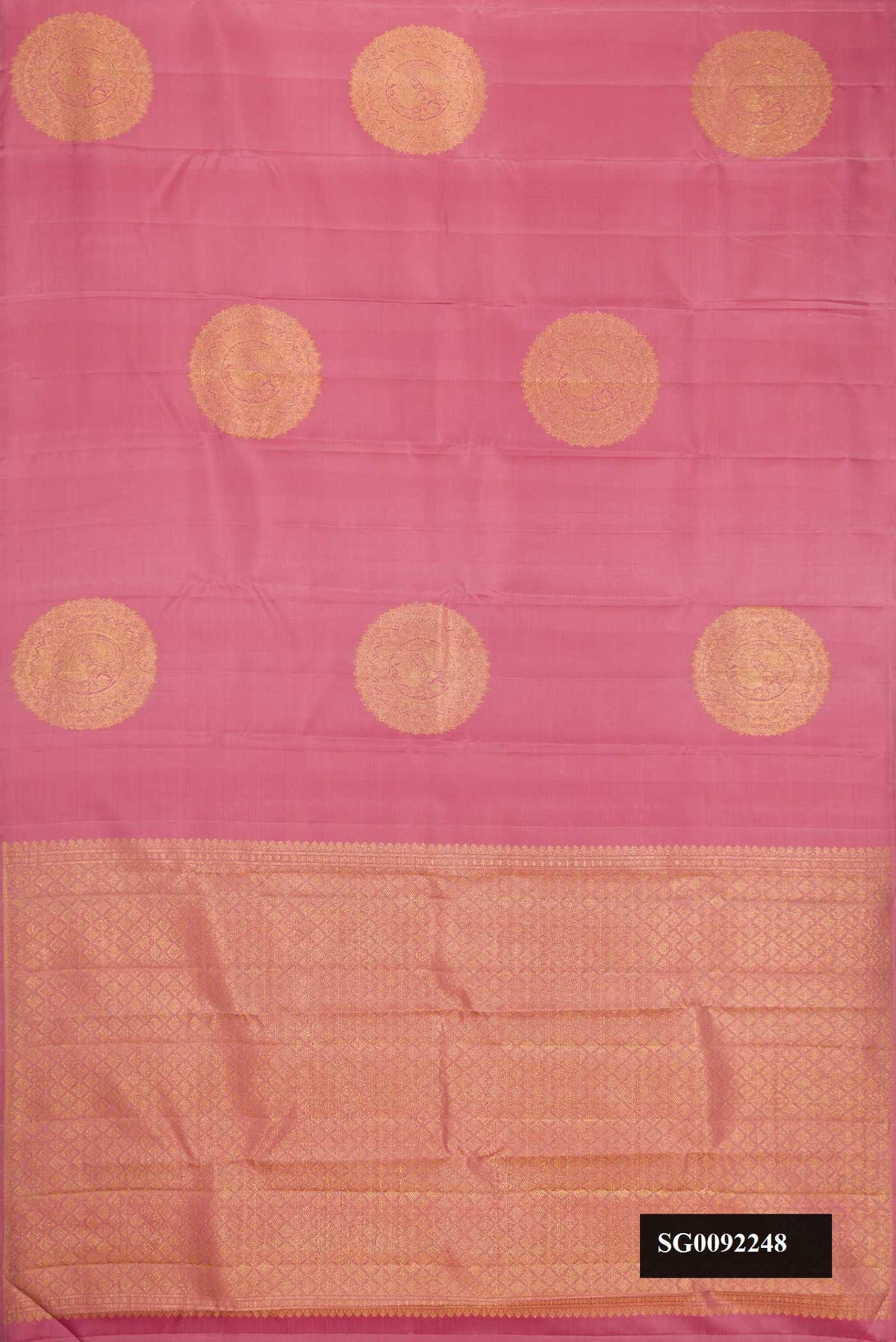 Rose Gold Dual Tone Kanchipuram Silk Saree with Zari Butta on the body and Without Border.  displayed on a mannequin