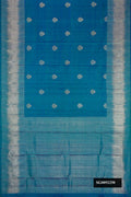 Peacock Blue Dual Tone Kanchipuram Silk Saree with Zari Butta on the body and Zari Border.  displayed on a mannequin