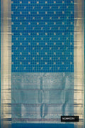 Peacock Blue Dual Tone Kanchipuram Silk Saree with Checked design on the body and Zari Border.  displayed on a mannequin