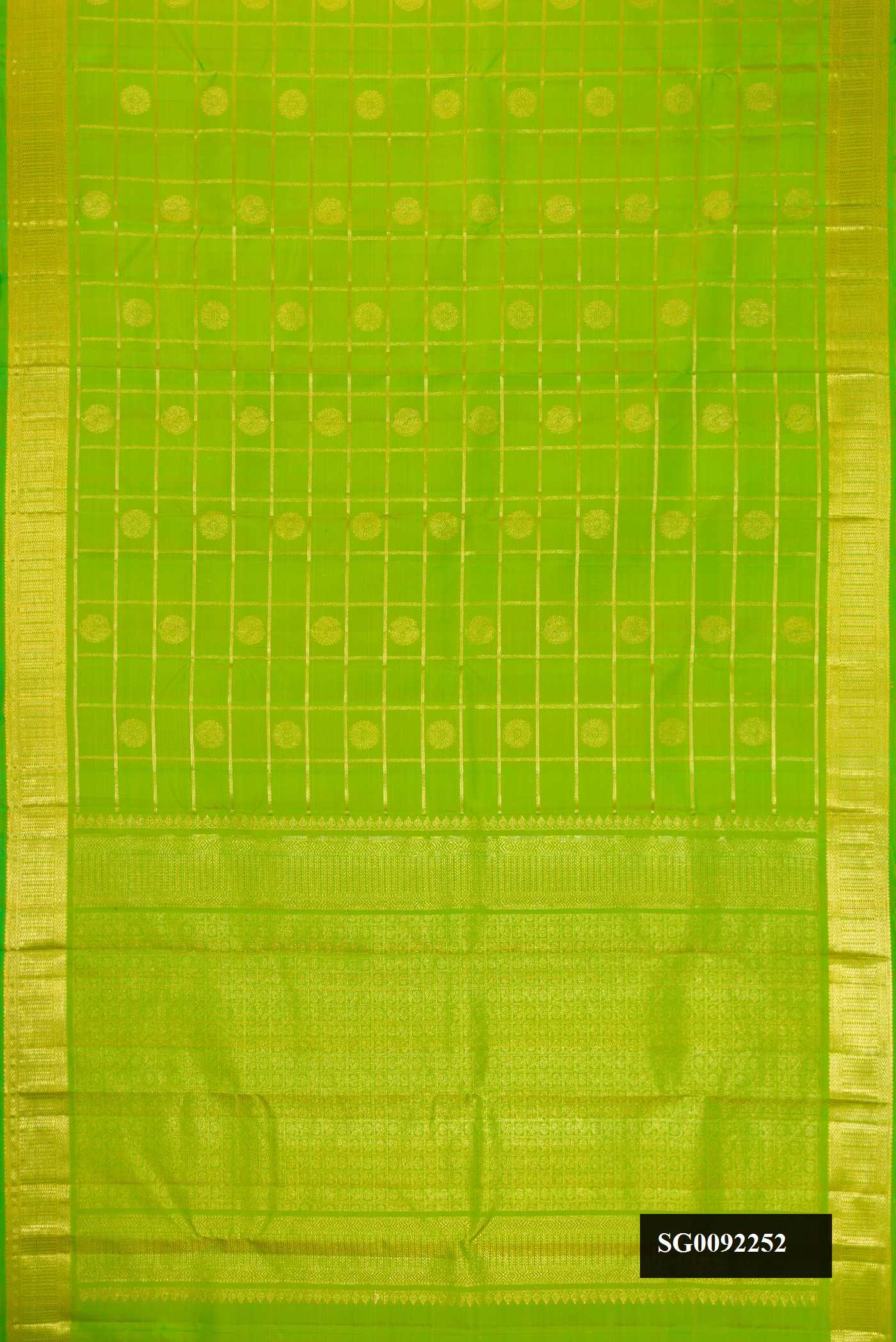 Parrot Green Dual Tone Kanchipuram Silk Saree with Checked design on the body and Zari Border.  displayed on a mannequin
