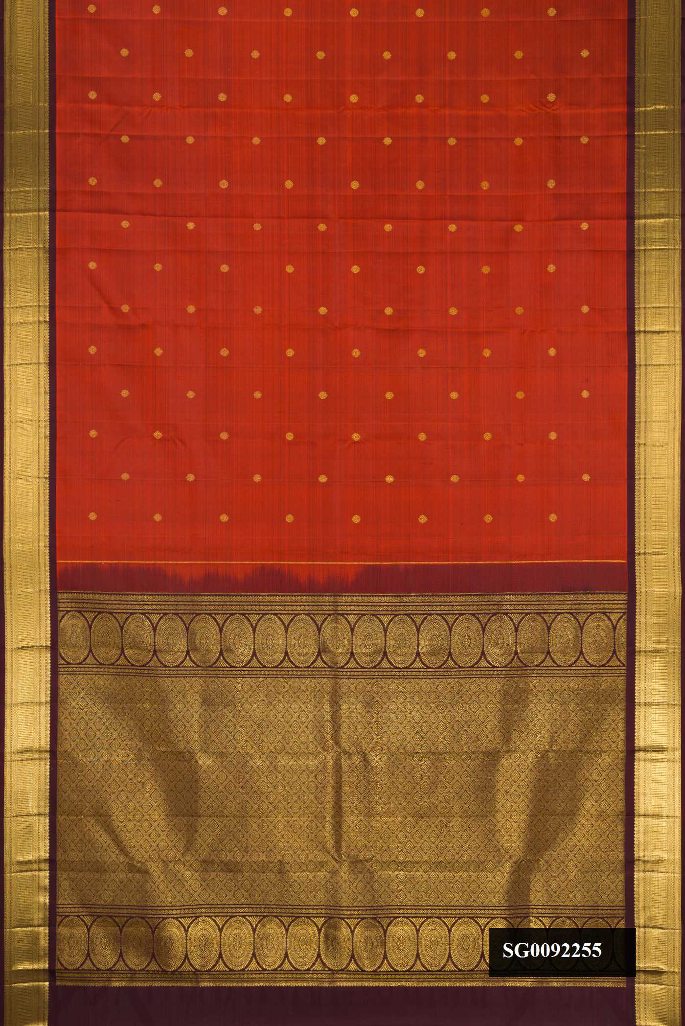 Red Dual Tone Kanchipuram Silk Saree with Zari Butta on the body and Zari Border.  displayed on a mannequin