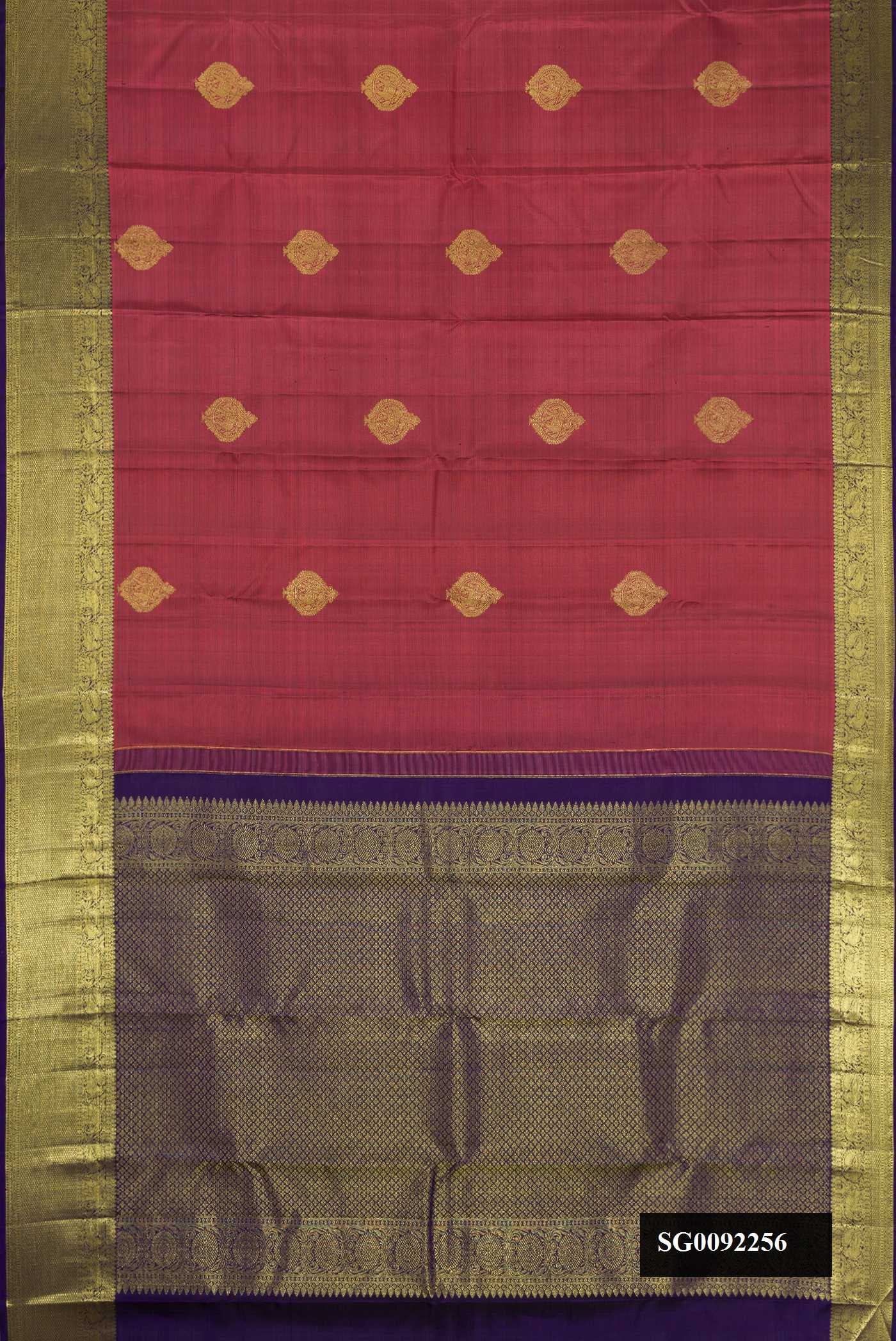 Rose Gold Dual Tone Kanchipuram Silk Saree with Zari Butta on the body and Zari Border.  displayed on a mannequin