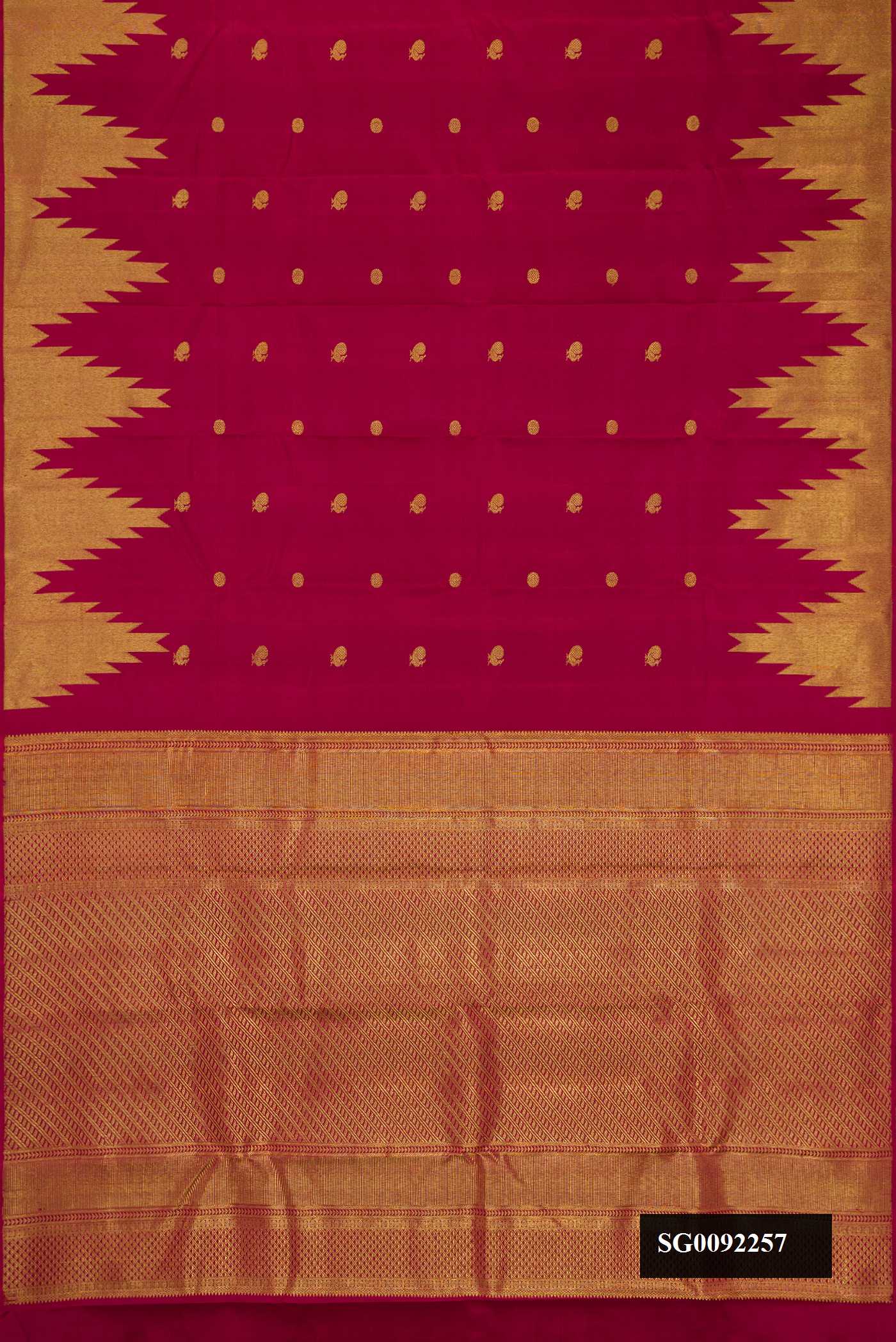 Maroon Dual Tone Kanchipuram Silk Saree with Zari Butta on the body and Temple Border.  displayed on a mannequin