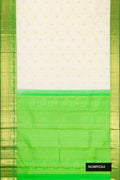 Off White Dual Tone Kanchipuram Silk Saree with Zari Butta on the body and Zari Border.  displayed on a mannequin