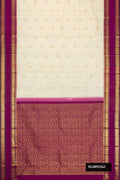 Off White Dual Tone Kanchipuram Silk Saree with Zari Butta on the body and Zari Border.  displayed on a mannequin