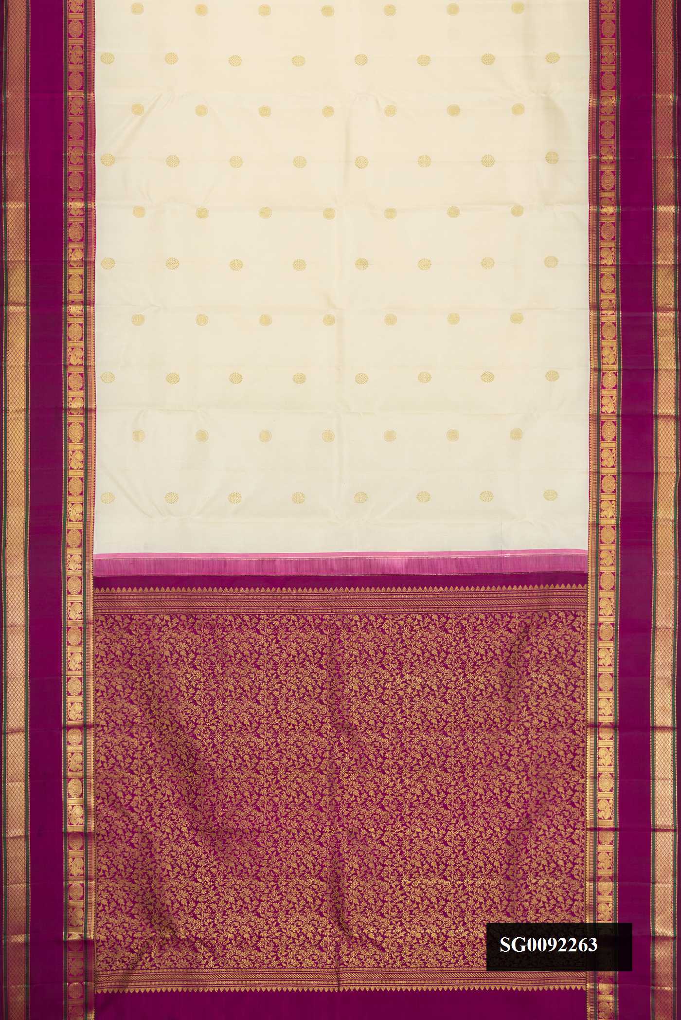 Off White Dual Tone Kanchipuram Silk Saree with Zari Butta on the body and Zari Border.  displayed on a mannequin