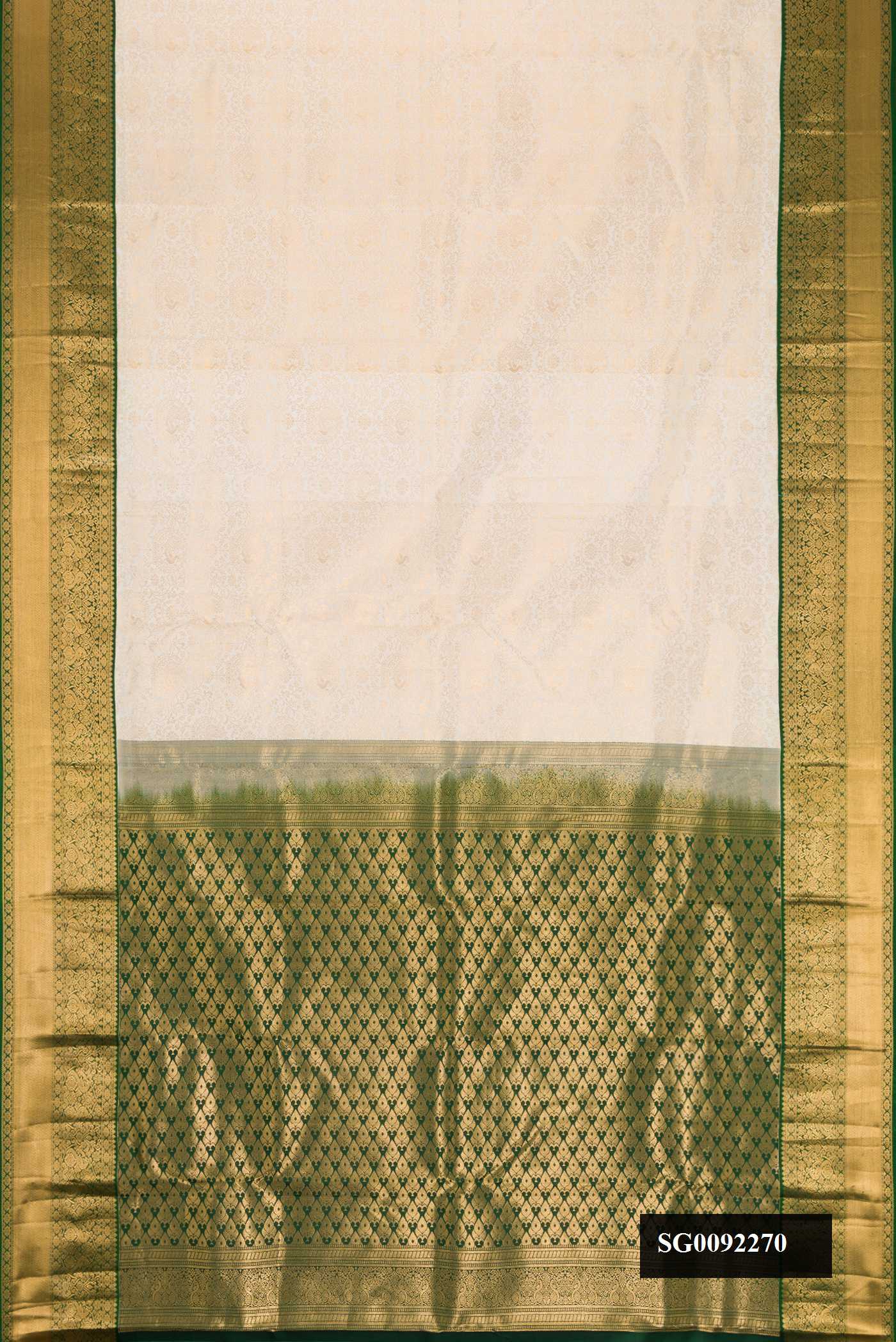 Off White Dual Tone Kanchipuram Silk Saree with Zari Brocade on the body and Zari Border.  displayed on a mannequin