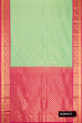 Pista Green Dual Tone Kanchipuram Silk Saree with Zari Brocade on the body and Zari Border.  displayed on a mannequin