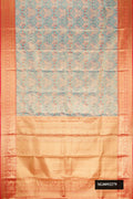 Blue Dual Tone Kanchipuram Tissue Silk Saree with Zari Brocade on the body and Zari Border.  displayed on a mannequin