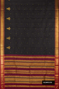 Black Dual Tone Kanchipuram Silk Saree with Zari Butta on the body and Zari And Thread Border.  displayed on a mannequin