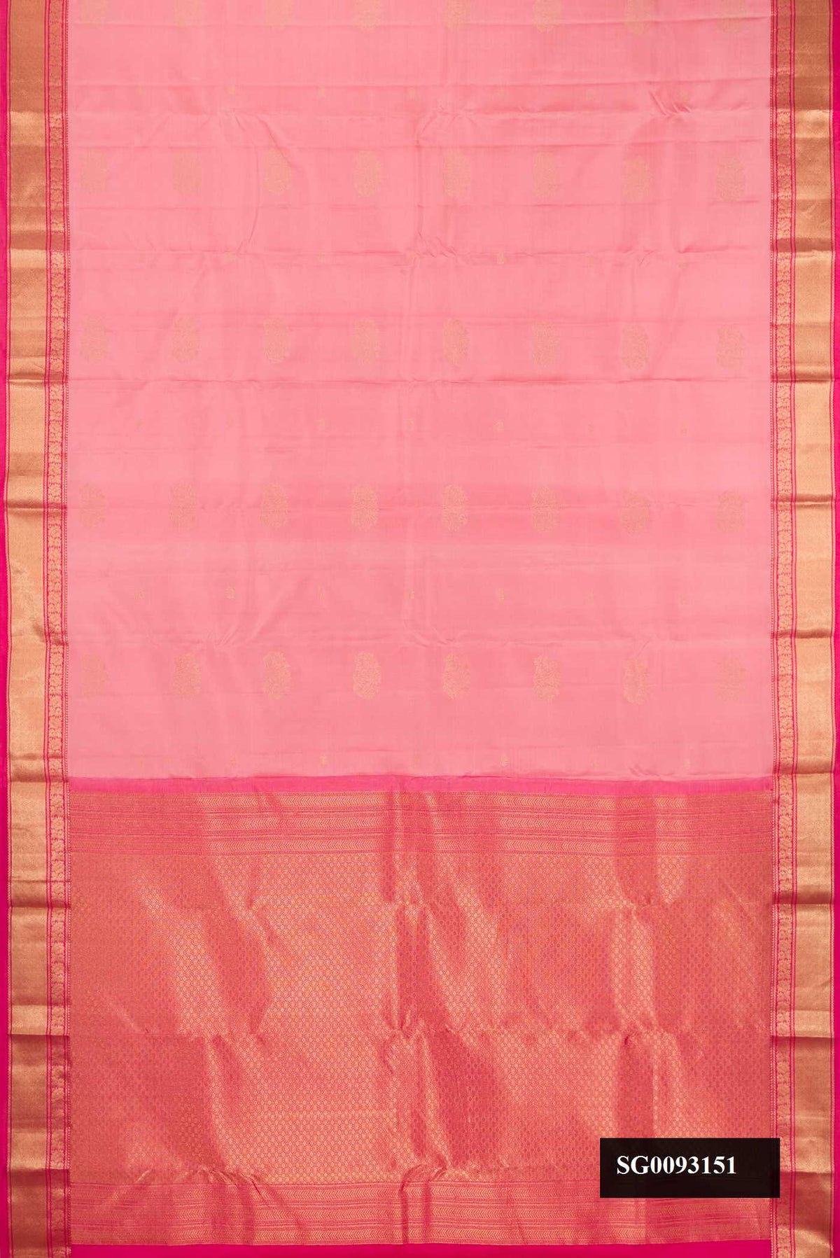 Rose Gold Dual Tone Kanchipuram Silk Saree with Zari Butta on the body and Zari Border.  displayed on a mannequin