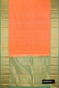Golden Peach Dual Tone Kanchipuram Silk Saree with Checked design on the body and Zari Border.  displayed on a mannequin