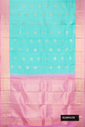 Sky Blue Dual Tone Kanchipuram Silk Saree with Zari Butta on the body and Zari Border.  displayed on a mannequin