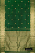 Bottle Green Dual Tone Kanchipuram Silk Saree with Zari Butta on the body and Zari Border.  displayed on a mannequin