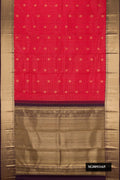 Red Dual Tone Kanchipuram Silk Saree with Checked design on the body and Zari Border.  displayed on a mannequin