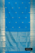 Sky Blue Dual Tone Kanchipuram Silk Saree with Zari Butta on the body and Zari Border.  displayed on a mannequin