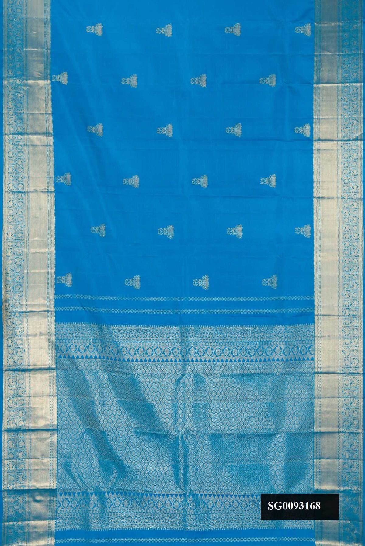 Sky Blue Dual Tone Kanchipuram Silk Saree with Zari Butta on the body and Zari Border.  displayed on a mannequin