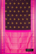Coffee Brown Dual Tone Kanchipuram Silk Saree with Zari Butta on the body and Zari Border.  displayed on a mannequin