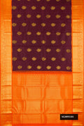 Maroon Dual Tone Kanchipuram Silk Saree with Zari Butta on the body and Zari Border.  displayed on a mannequin