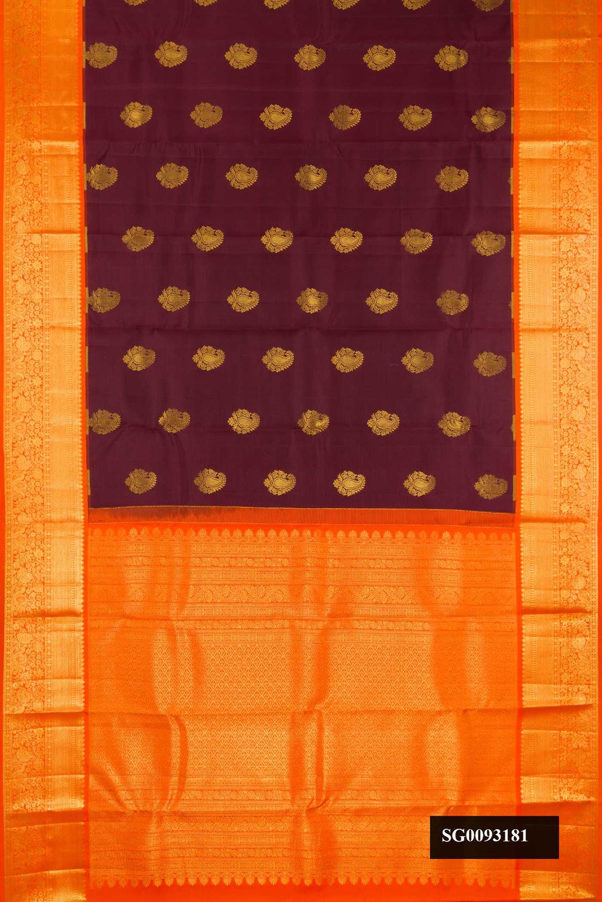 Maroon Dual Tone Kanchipuram Silk Saree with Zari Butta on the body and Zari Border.  displayed on a mannequin