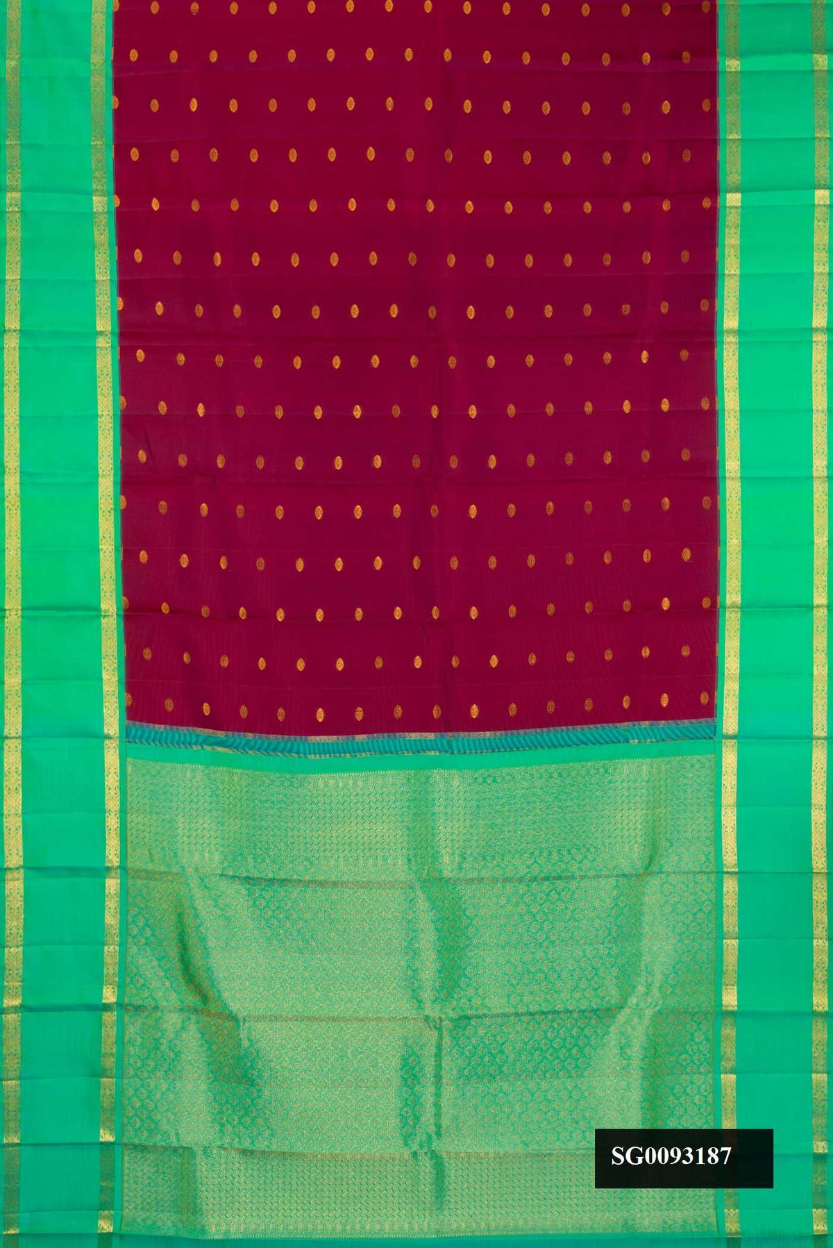Maroon Dual Tone Kanchipuram Silk Saree with Zari Butta on the body and Zari Border.  displayed on a mannequin