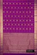 Purple Dual Tone Kanchipuram Silk Saree with Checked design on the body and Zari Border.  displayed on a mannequin