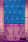 Peacock Blue Dual Tone Kanchipuram Silk Saree with Checked design on the body and Zari Border.  displayed on a mannequin