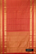 Rust Dual Tone Kanchipuram Silk Saree with Stripes on the body and Zari Border.  displayed on a mannequin