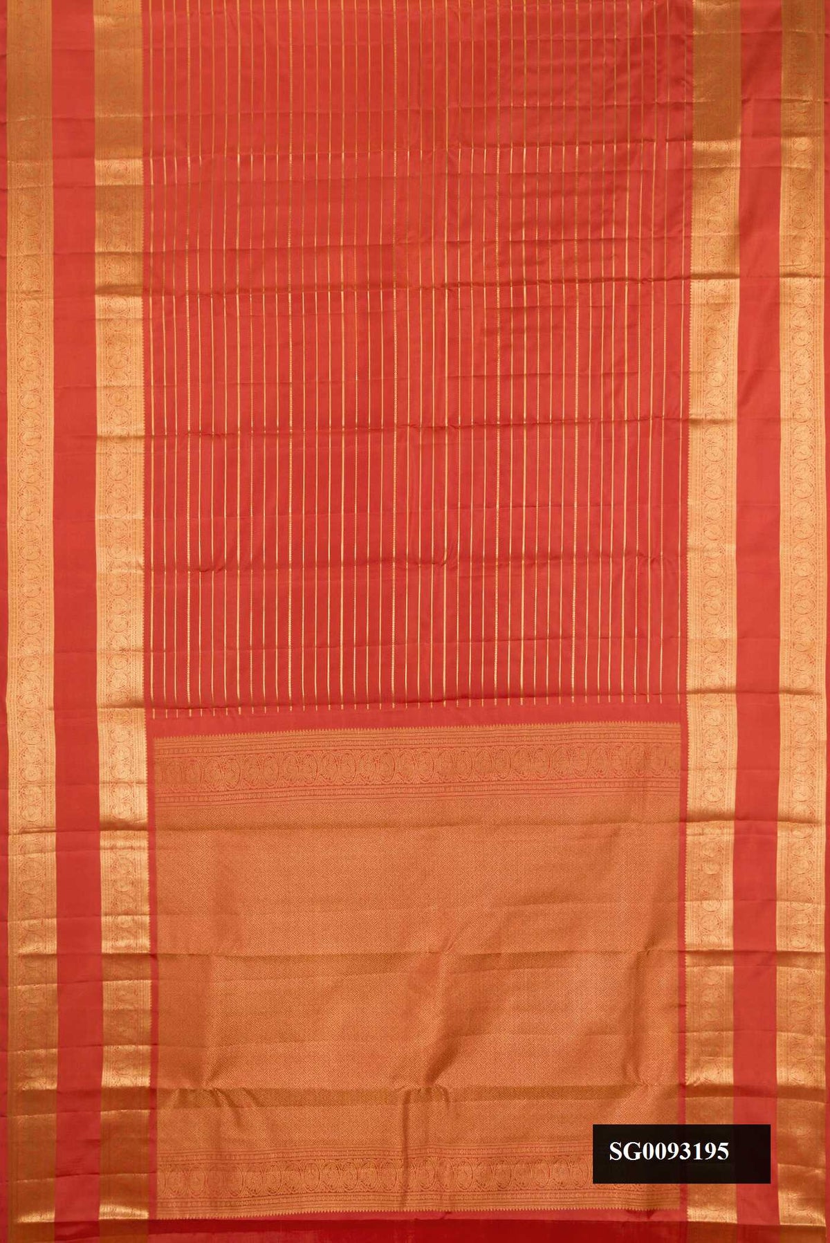 Rust Dual Tone Kanchipuram Silk Saree with Stripes on the body and Zari Border.  displayed on a mannequin