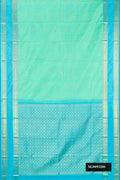 Pista Green Dual Tone Kanchipuram Silk Saree with Zari Butta on the body and Zari Border.  displayed on a mannequin