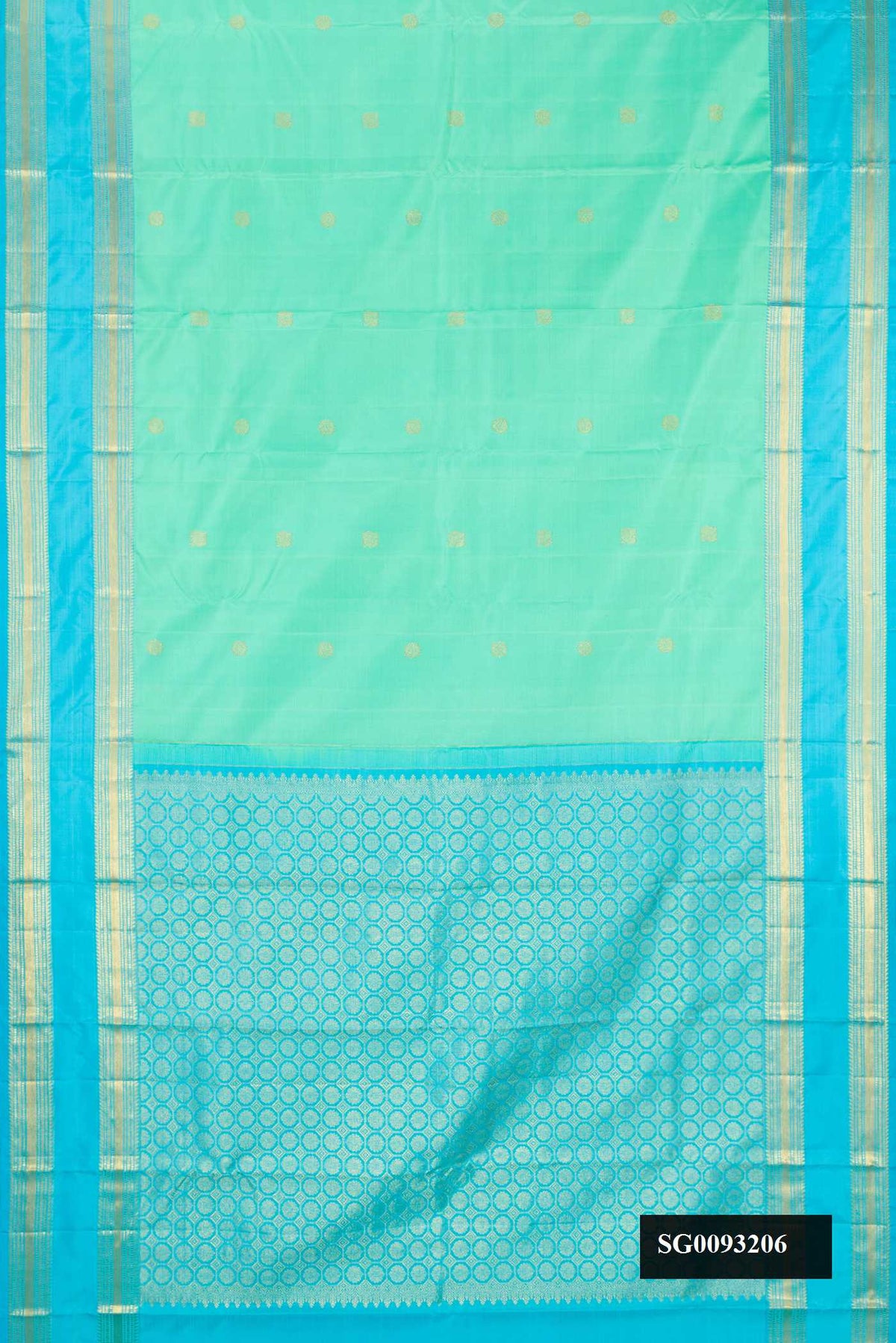 Pista Green Dual Tone Kanchipuram Silk Saree with Zari Butta on the body and Zari Border.  displayed on a mannequin