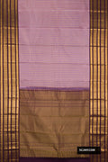 Lavender Dual Tone Kanchipuram Silk Saree with Checked design on the body and Fancy Border.  displayed on a mannequin
