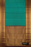 Green Dual Tone Kanchipuram Silk Saree with Checked design on the body and Zari Border.  displayed on a mannequin