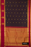 Black Dual Tone Kanchipuram Silk Saree with Zari Butta on the body and Fancy Border.  displayed on a mannequin