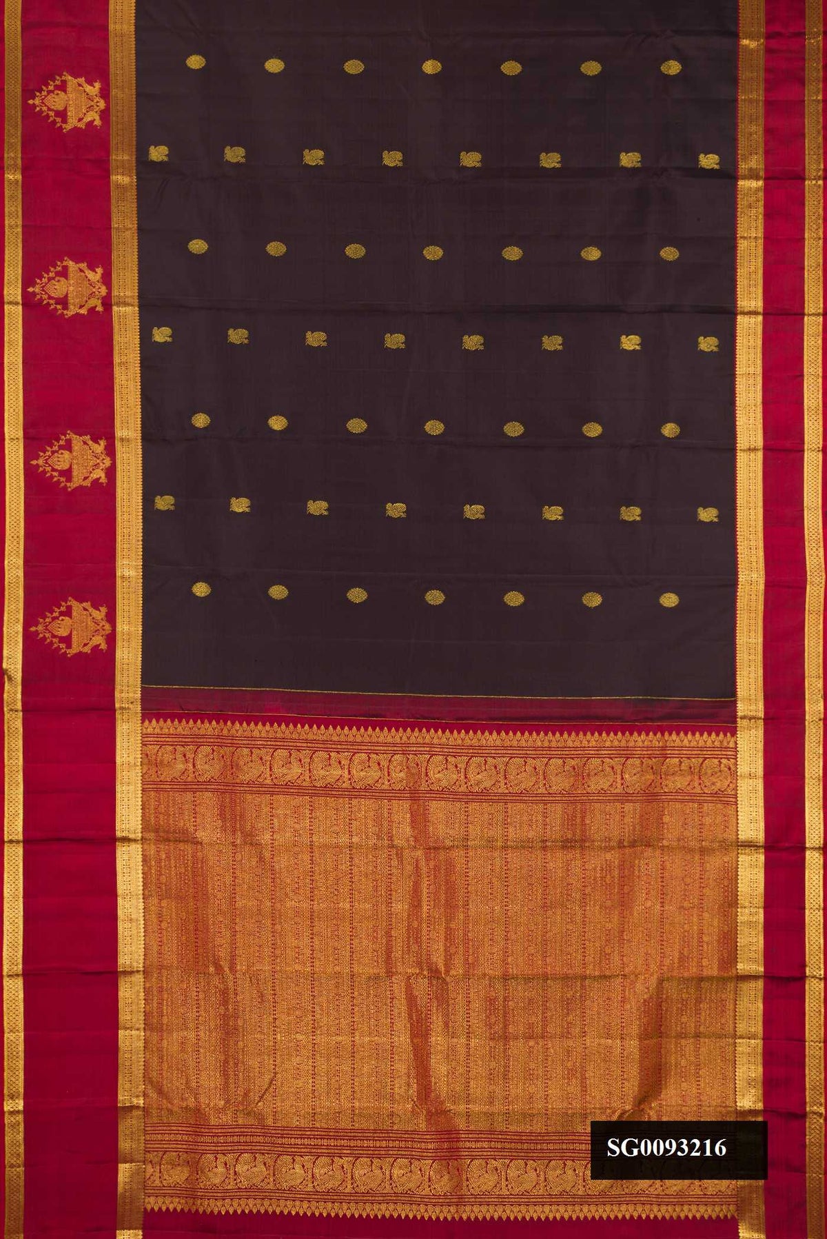 Black Dual Tone Kanchipuram Silk Saree with Zari Butta on the body and Fancy Border.  displayed on a mannequin