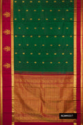 Bottle Green Dual Tone Kanchipuram Silk Saree with Zari Butta on the body and Zari Border.  displayed on a mannequin