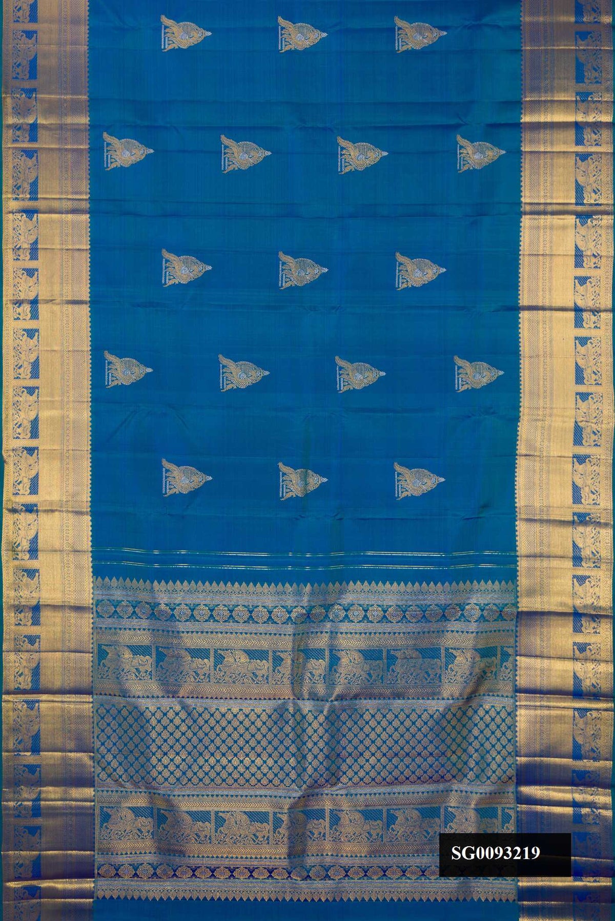 Peacock Blue Dual Tone Kanchipuram Silk Saree with Zari Butta on the body and Fancy Border.  displayed on a mannequin